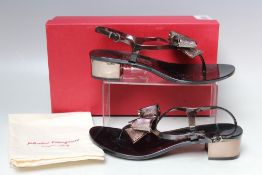 A BOXED PAIR OF SALVATORE FERRAGAMO BLOCK HEEL SANDALS. in black, metallic and opaque PVC, US size