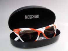 A PAIR OF RETRO 1950S STYLE MOSCHINO STRIPED CATS EYE SUNGLASSES, new / old stock with case and
