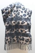 A BURBERRY 'HELENE' CASHMERE BLEND ANIMAL PRINT STOLE / SCARF, welt pockets on reverse, fringe