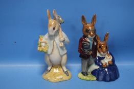 A ROYAL DOULTON BUNNYKINS 'FAMILY PHOTOGRAPH' TOGETHER WITH A BESWICK 'PETER RABBIT GARDENING' (2)