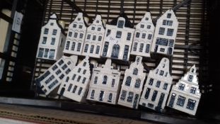 A TRAY CONTAINING TWELVE KLM BOLS DELFT PORCELAIN HOUSES (TRAY NOT INCLUDED)