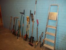 A SELECTION OF GARDEN TOOLS TO INCLUDE AN ALUMINIUM STEP LADDER AND A PICK AXE.