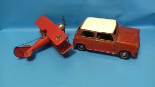 A LARGE TIN PLATE MINI AND A TIN PLATE GERMAN BI-PLANE