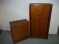 A TWO PIECE BEDROOM SUITE WITH SLIDING DOORS CONSISTING OF A WARDROBE AND A FIVE DRAWER CHEST MADE