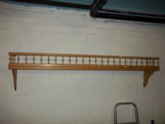 A VINTAGE SOLID PINE GALLERY SHELF