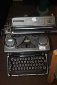 A VINTAGE IMPERIAL TYPEWRITER TOGETHER WITH A HARD SUITCASE