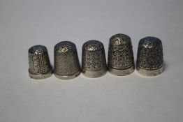 FIVE SILVER THIMBLES