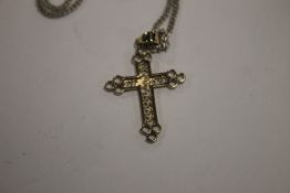 A CROSS ON A SILVER CHAIN