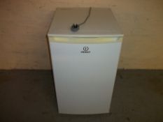 AN INDESIT UNDER COUNTER FREEZER