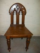 AN ANTIQUE OAK GOTHIC STYLE CHAIR