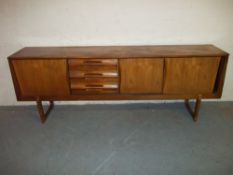 A VINTAGE RETRO TEAK SIDEBOARD.