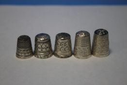 FIVE SILVER THIMBLES