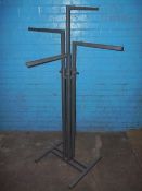 AN ADJUSTABLE CORNER CLOTHES DISPLAY RACK.