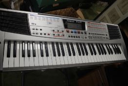 A ROLAND EM-15 ELECTRIC KEYBOARD ON STAND - NO PLUG