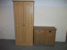 A MODERN TWO DOOR WARDROBE AND AN OAK SIDEBOARD