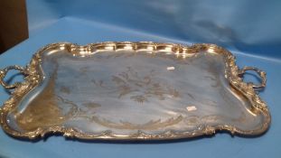 A LARGE SILVER PLATED ART NOUVEAU TWIN HANDLED TRAY