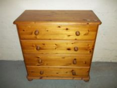 TWO SOLID PINE CHESTS OF DRAWERS A FOUR DRAWER CHEST AND A TWO OVER THREE DRAWER CHEST.