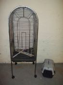 A LARGE PARROT CAGE AND A CAT CARRIER