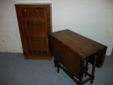 AN OAK DROPLEAF TABLE AND A CHINA DISPLAY CABINET (2)
