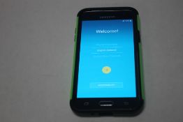 A SAMSUNG GALAXY J3 ANDROID PHONE WITH CHARGER APPEARS TO BE IN WORKING ORDER