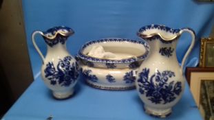 A LARGE BLUE & WHITE FOOT BATH TOGETHER WITH A COPELAND JUG AND ANOTHER