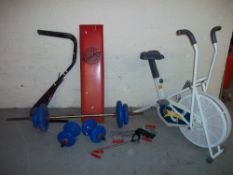 A SELECTION OF EXERCISE EQUIPMENT TO INCLUDE AN EXERCISE BIKE, WEIGHTS BENCH AND BARBALL / DUMBELL
