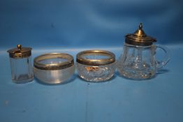 FOUR SILVER TOPPED GLASS SALTS / MUSTARD POTS