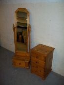 A DRESSING MIRROR AND A FOUR DRAWER NARROW CHEST IN SOLID PINE.