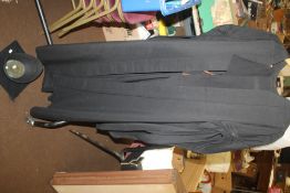 A UNIVERSITY GOWN WITH MORTAR BOARD