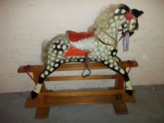 A VINTAGE ROCKING HORSE.