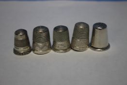 FIVE SILVER THIMBLES