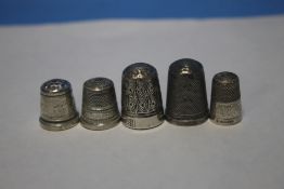 FIVE SILVER THIMBLES