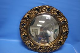 A CIRCULAR FRAMED MIRROR, 45 CM DIAMETER