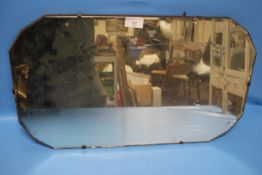 A HANGING WALL MIRROR 56 X 34 CM