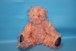 A PINK JOINTED TEDDY BEAR