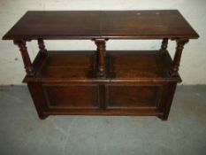 AN OAK DOUBLE SPLIT MONKS BENCH.