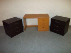 A MODERN DRESSING TABLE AND 2 3 DRAWER NARROW CHESTS.