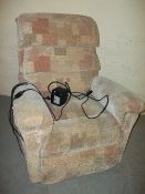 A FABRIC LAZYBOY RISE AND RECLINE CHAIR.