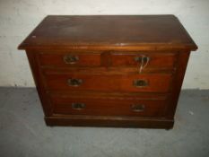 A MAHOGANY EARLY 1900S TWO OVER TWO CHEST OF DRAWERS.