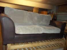 A MODERN THREE SEAT JUMBO CHORD SOFA