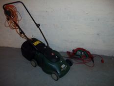 A BLACK AND DECKER ELECTRIC LAWN MOWER AND A GARDEN STRIMMER.