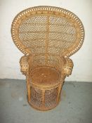 A VINTAGE WICKER PEACOCK FAN CHAIR