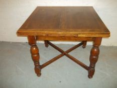 AN OAK DRAWLEAF TABLE