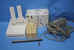 A NINTENDO WII AND ACCESSORIES