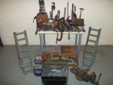 A SELECTION OF TOOLS TO INCLUDE AN ENGINEERS VISOR AND CAR Ramps.