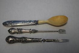 TWO SILVER PICKLE FORKS AND A SILVER HANDLED HORN SPOON (3)