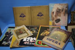 A SMALL COLLECTION OF VINTAGE ELVIS CALENDARS, PAUL MCCARTNEY PAINTING BOOK AND A BOOK ON OPERA