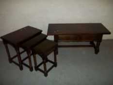 AN OAK NEST OF TABLES AND A COFFEE TABLE WITH TWO DRAWERS