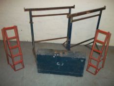A CARPENTERS TOOL BOX TO INCLUDE CONTENTS AND TWO CAR RAMPS AND TWO STEEL ADJUSTABLE TRESTLES.