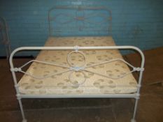 A CAST IRON DOUBLE BED FRAME